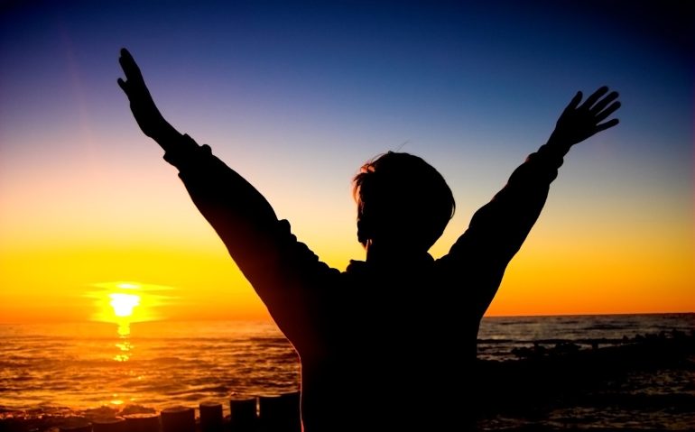 silhouette-aman-with-raised-arms